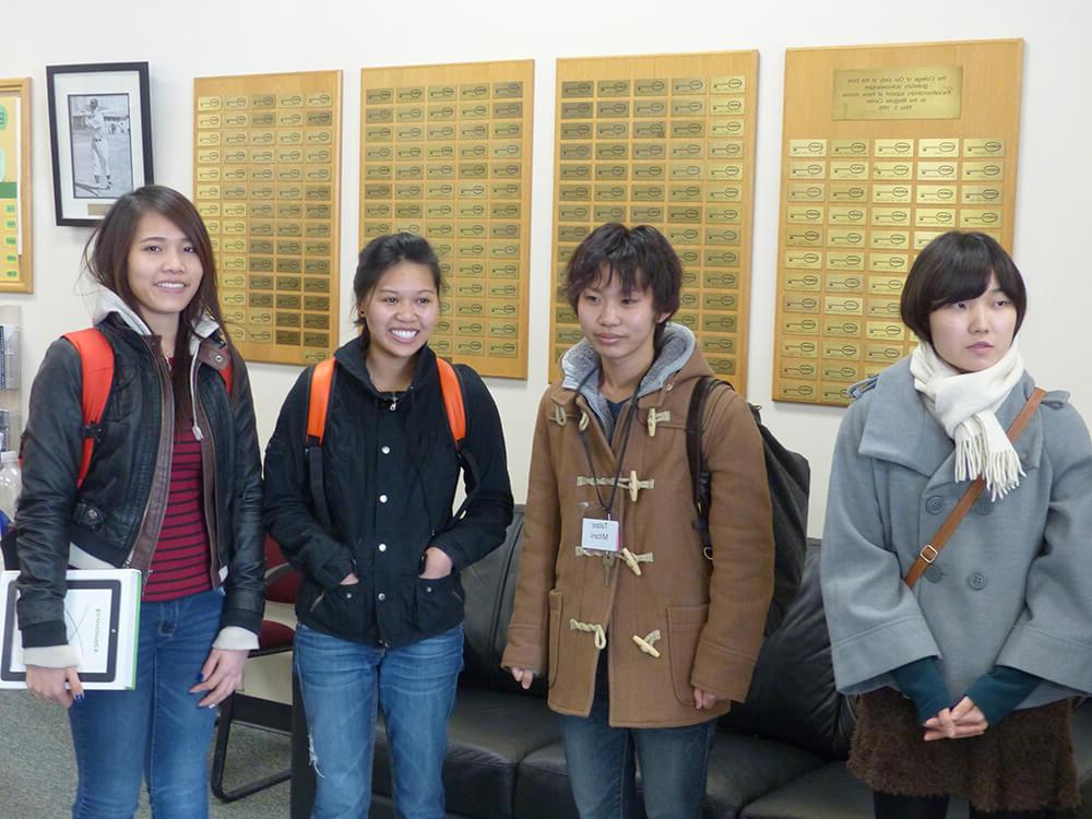 Photo of healthcare management graduate Tam Le with University of Kochi exchange students