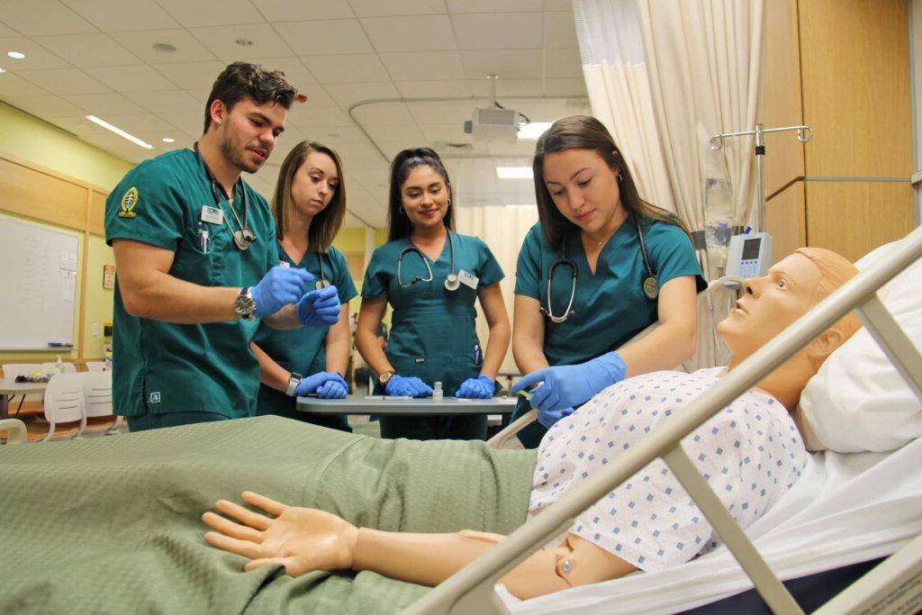Photo of nursing students in the simulation lab